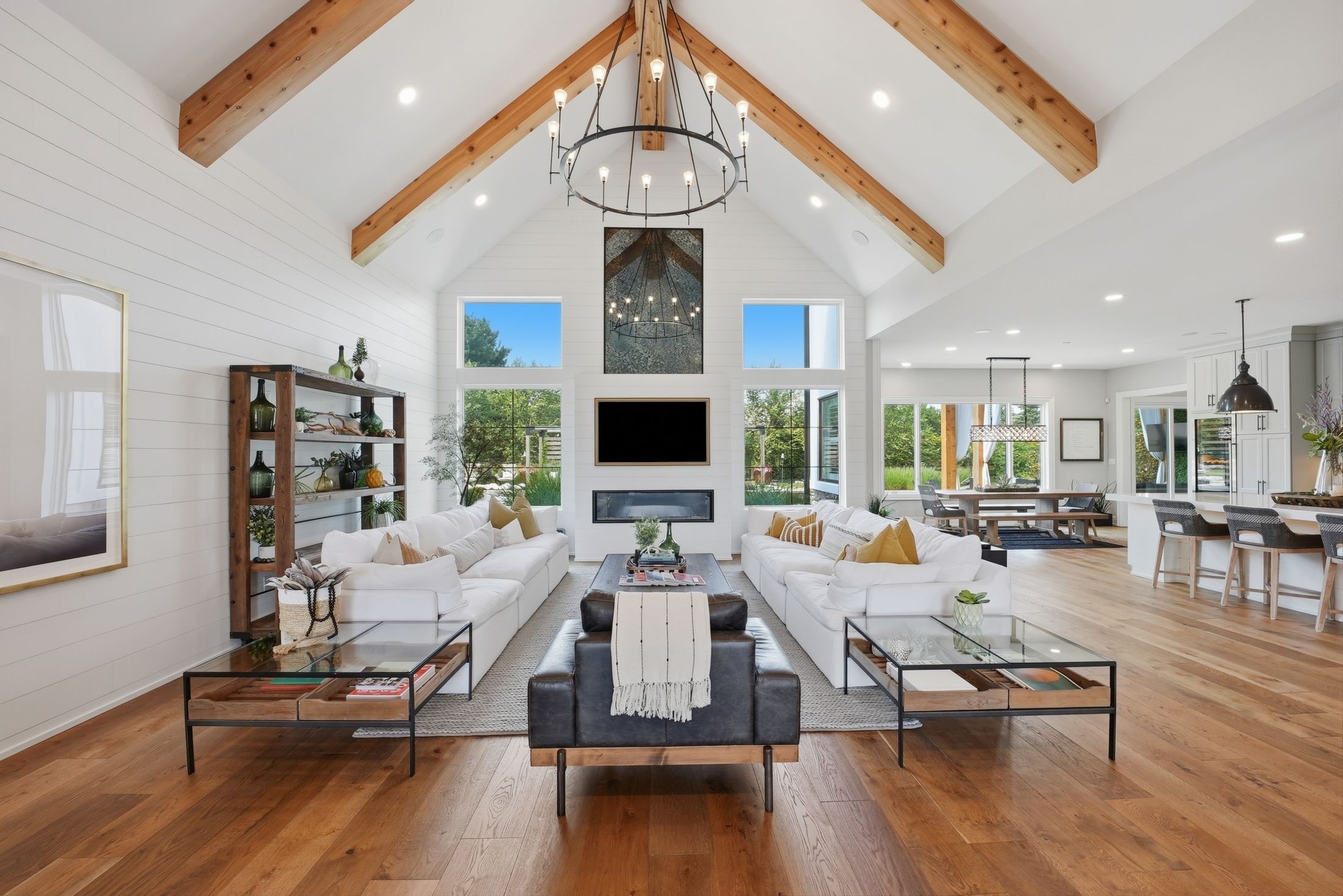 Vaulted great room with cedar beams and wall of windows